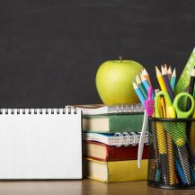 Education day arrangement on a table with copy space